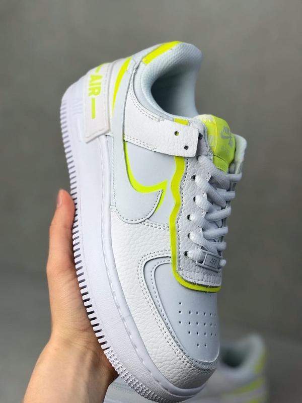 white and neon air force