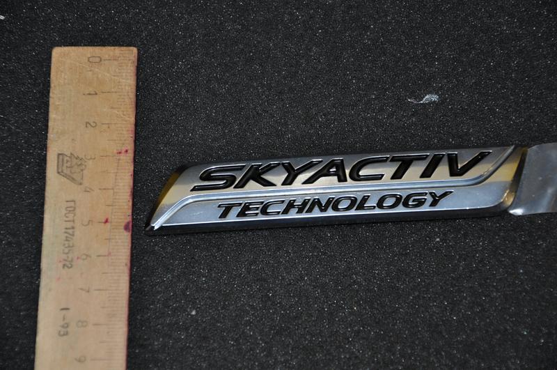 ЛОГОТИП (надпись, значок) Scyactiv (Mazda Мазда) Оригинал: цена 170 грн ...