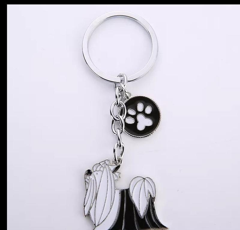 Брелок на ключи металл собака пес порода белая с черным болонк...