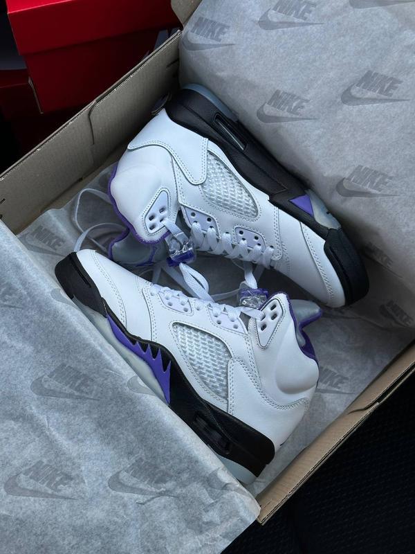 White black store and purple jordans