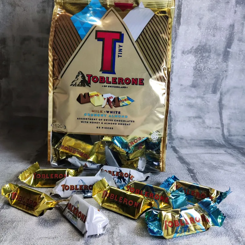 Toblerone - Milk White Crunchy-Almond  Mix 65st 520g